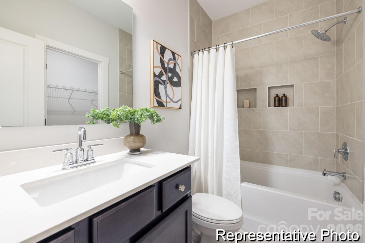 106 West Rice Planters Way, Unit 8P Statesville, NC 28625 - Photo 35 of 35 a bathroom with a sink a toilet and a bathtub