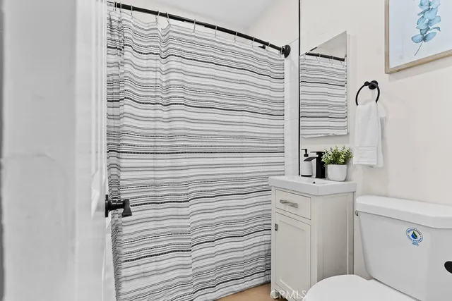 a bathroom with a sink and toilet