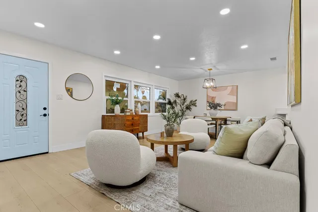 a living room with furniture and a large window