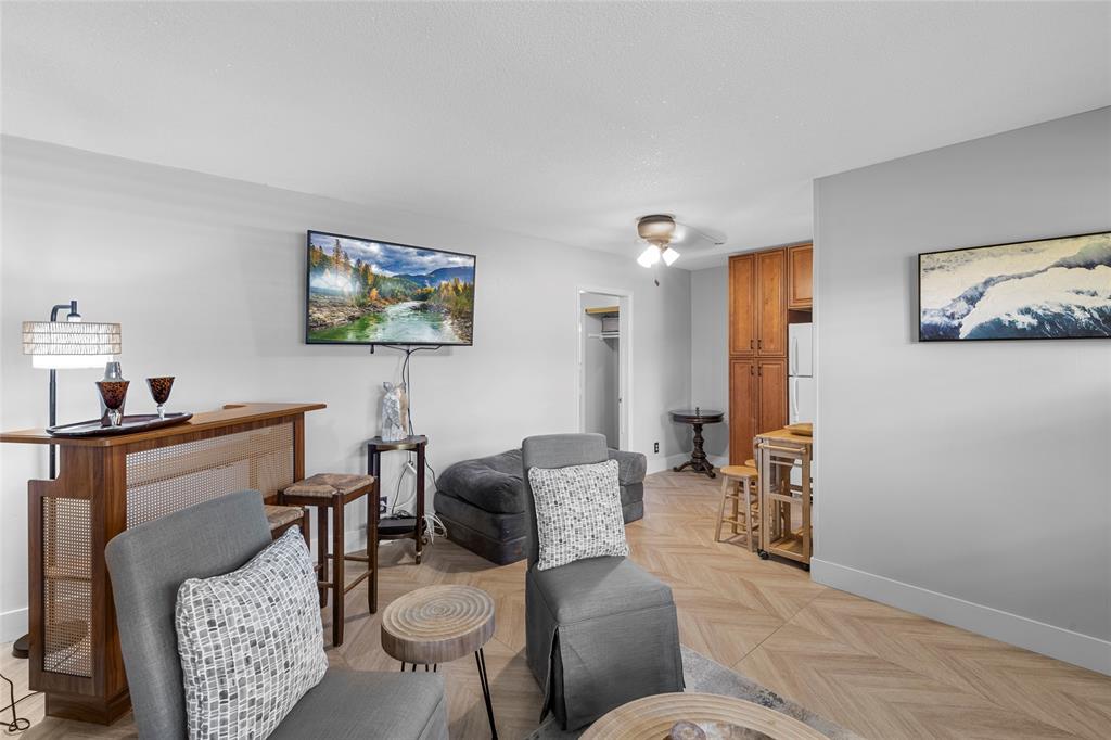 30 Southeast 13th Street, Unit A6 Boca Raton, FL 33432 - Photo 1 of 30 a living room with furniture a couch and a bookshelf