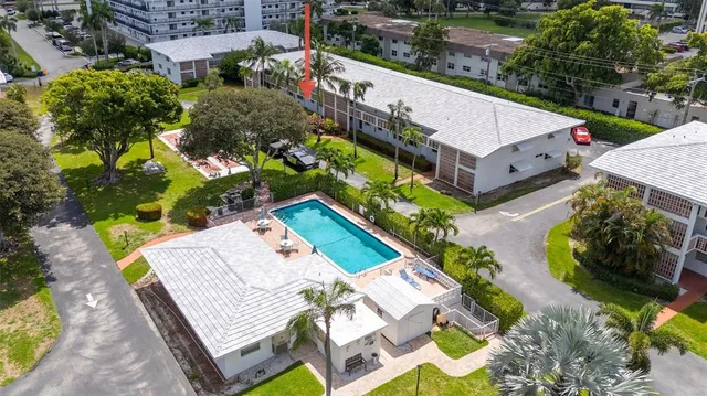 an aerial view of a house with outdoor space