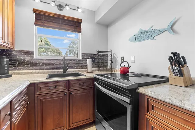 a kitchen with a sink and cabinets