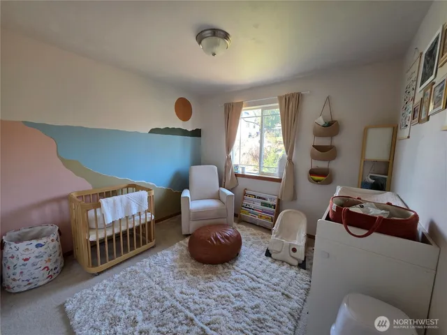 a bedroom with furniture and a window