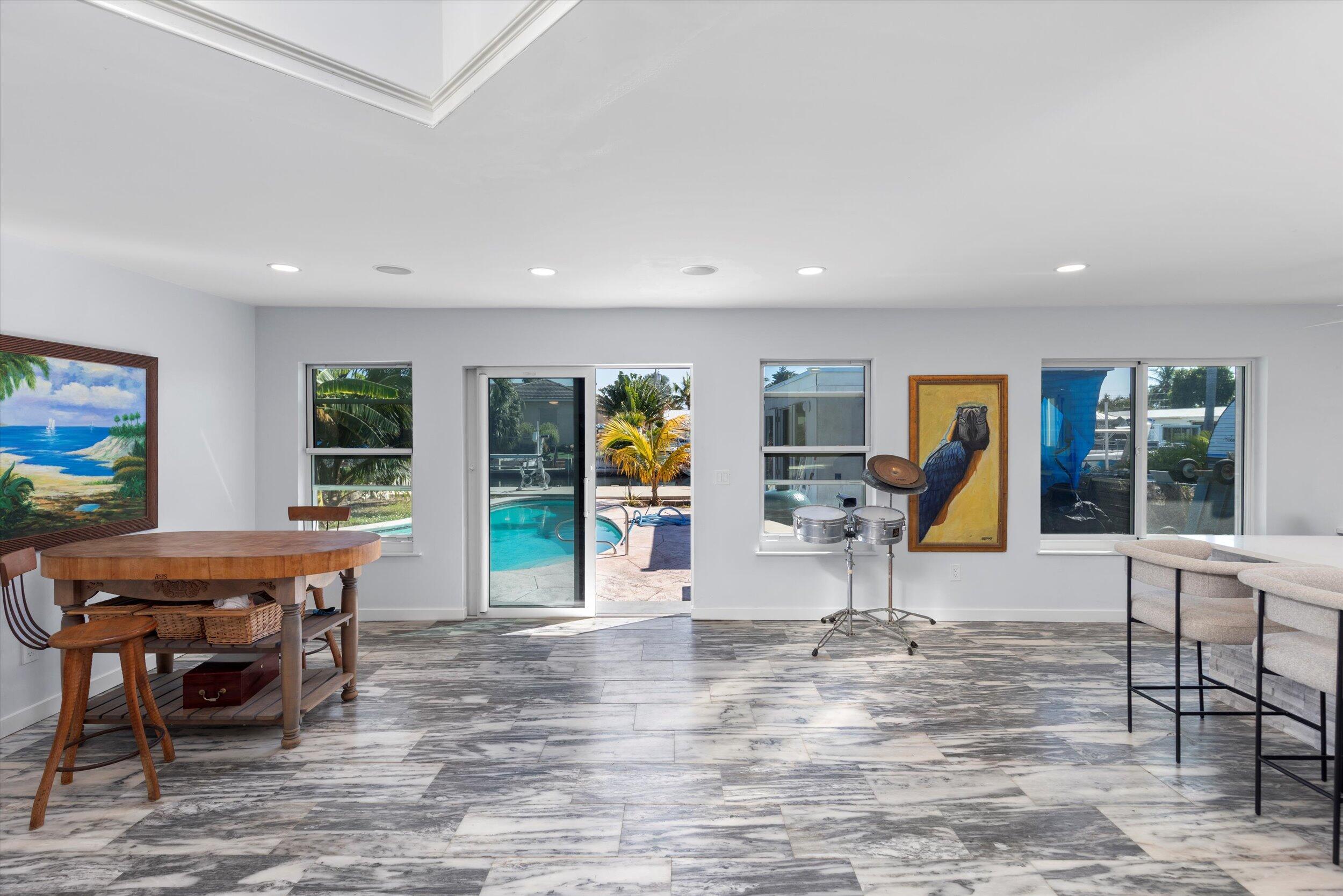 a view of a dining room with furniture wooden floor and windows