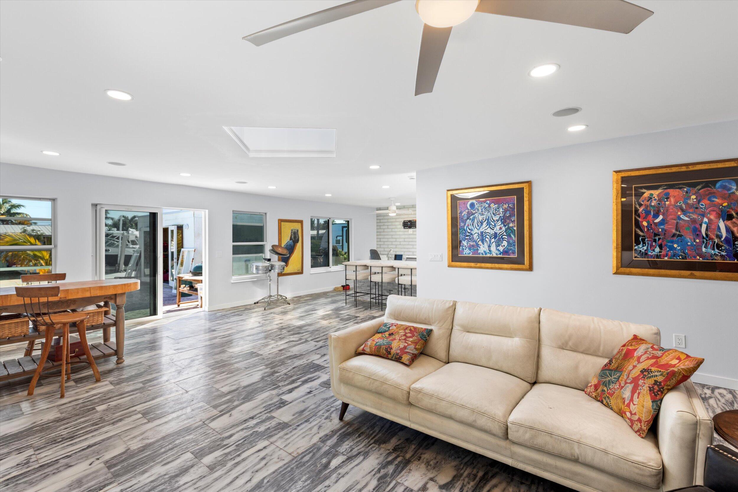2924 Riviera Drive Key West, FL 33040 - Photo 11 of 43 a living room with furniture kitchen view and a wooden floor