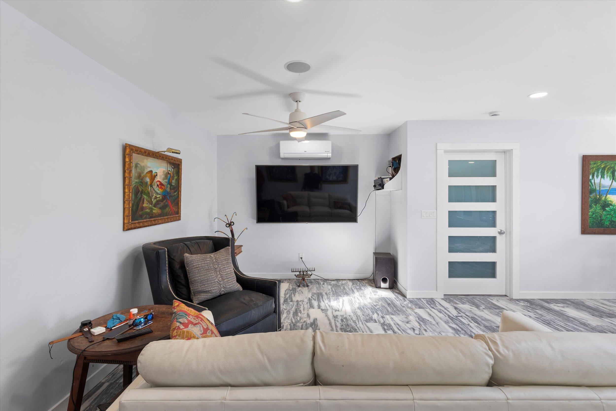 2924 Riviera Drive Key West, FL 33040 - Photo 12 of 43 a living room with furniture and a flat screen tv