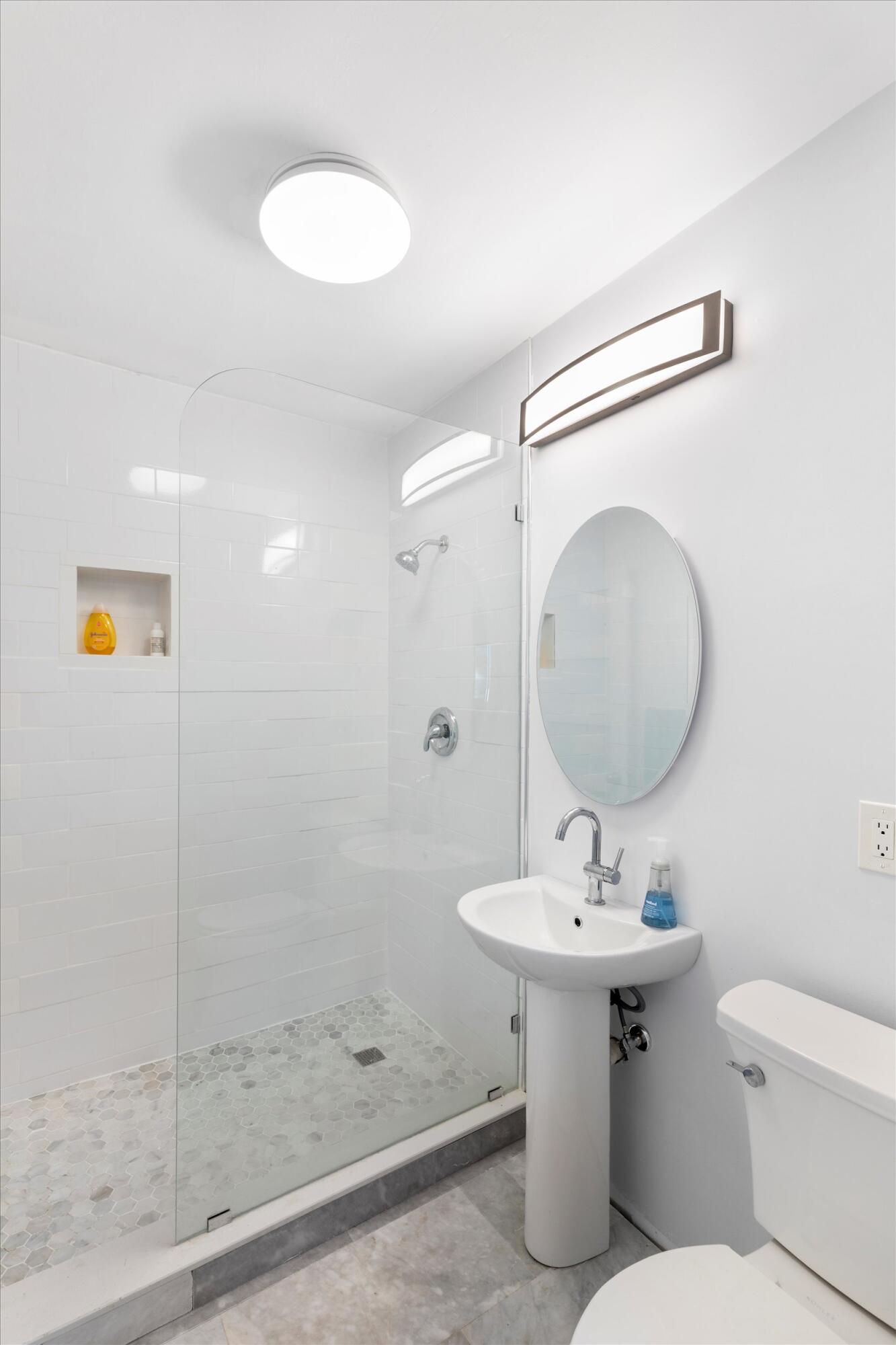 2924 Riviera Drive Key West, FL 33040 - Photo 15 of 43 a bathroom with a sink toilet and shower