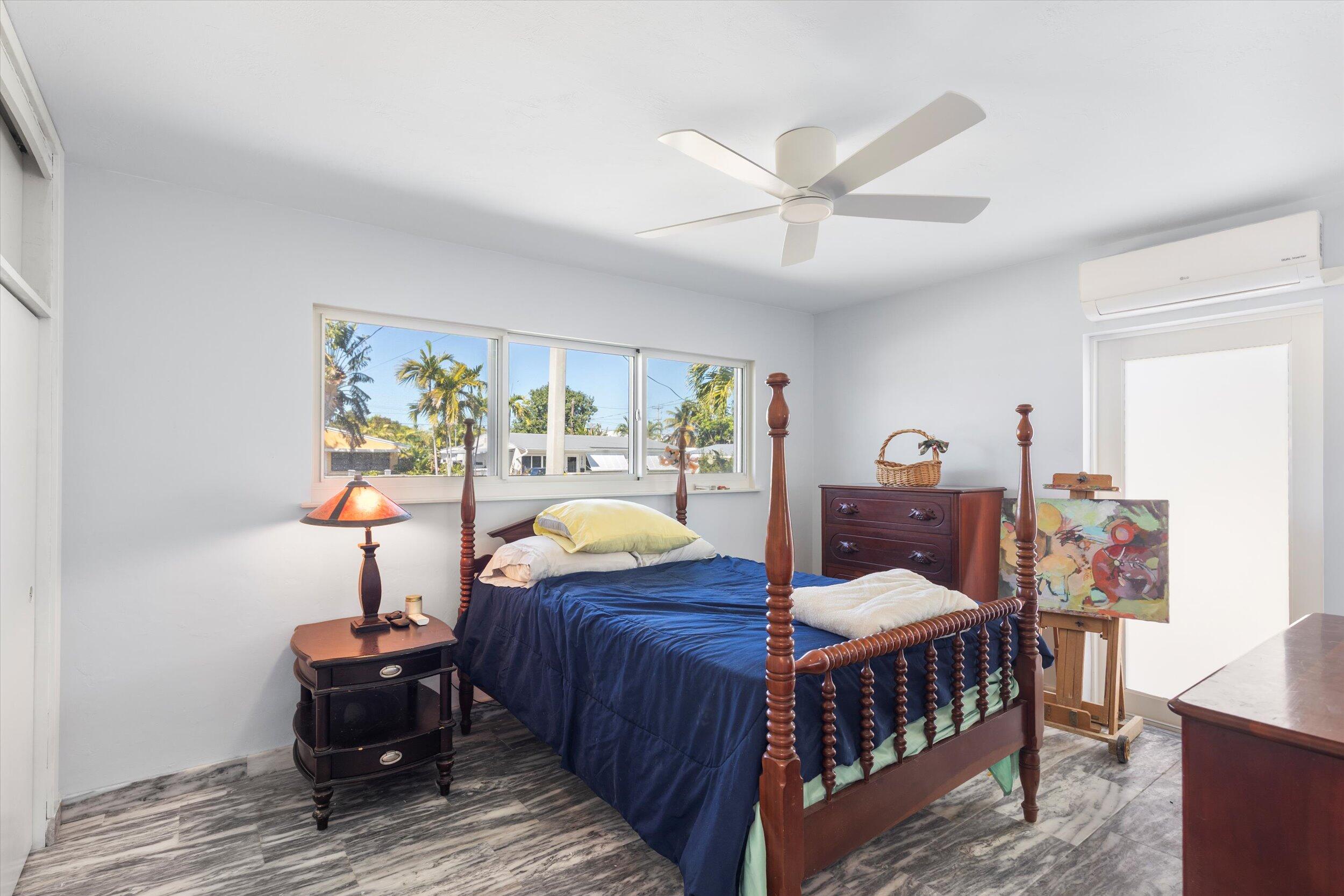 2924 Riviera Drive Key West, FL 33040 - Photo 16 of 43 a bedroom with furniture and a window