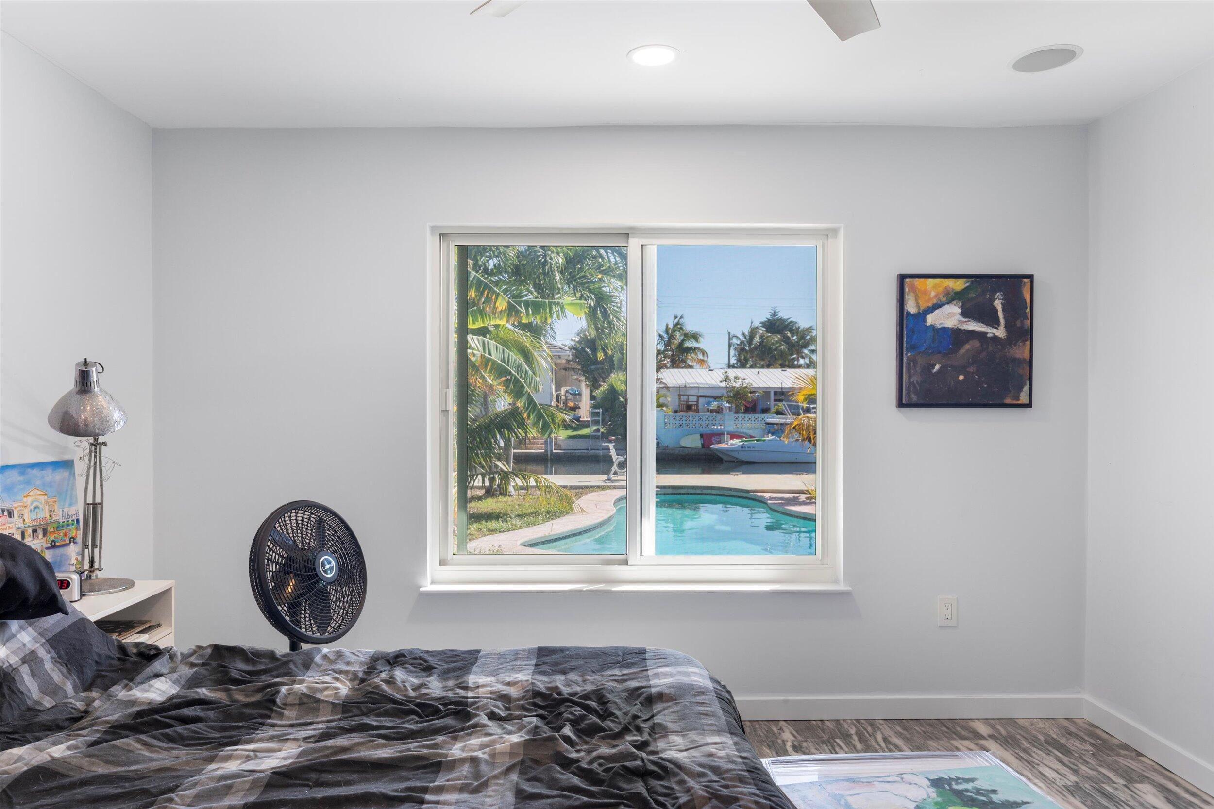 2924 Riviera Drive Key West, FL 33040 - Photo 19 of 43 a view of a storage and utility room with a window