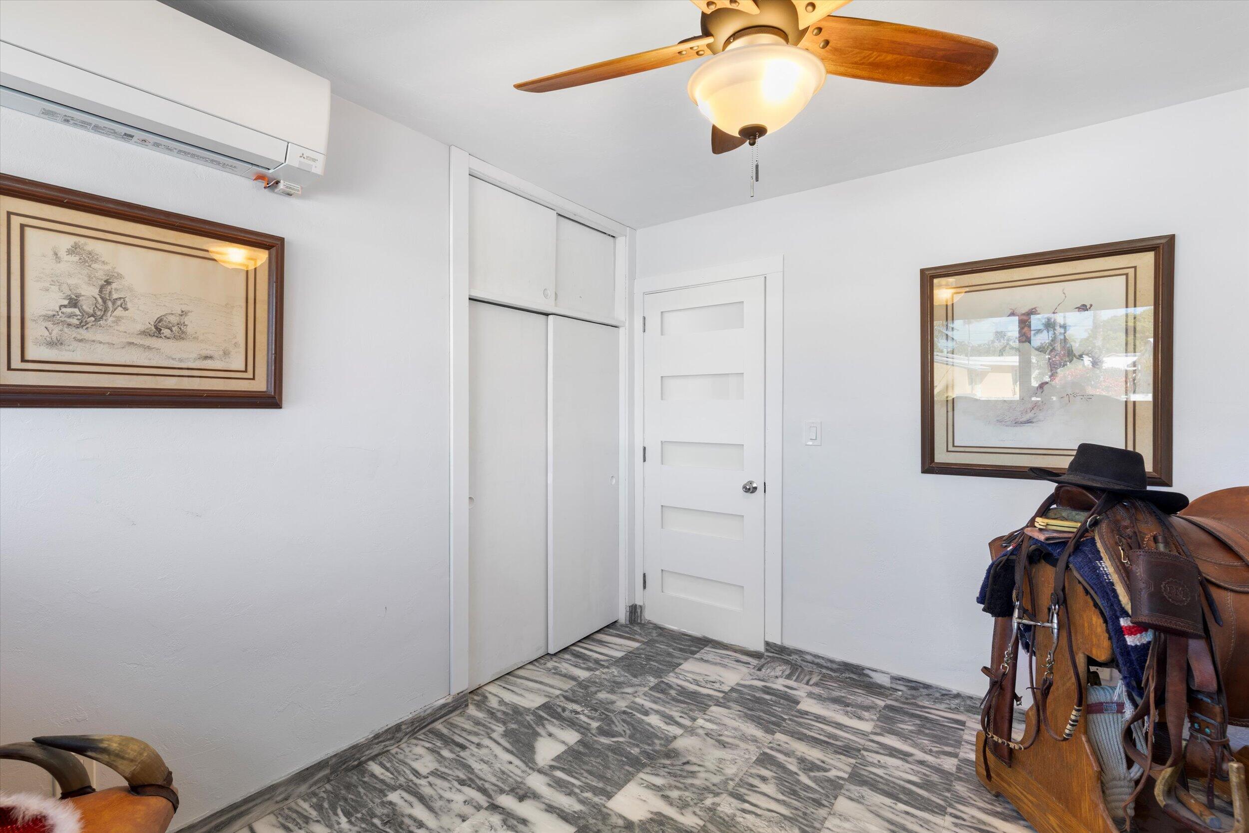 2924 Riviera Drive Key West, FL 33040 - Photo 21 of 43 a view of a livingroom with workspace and a chandelier fan