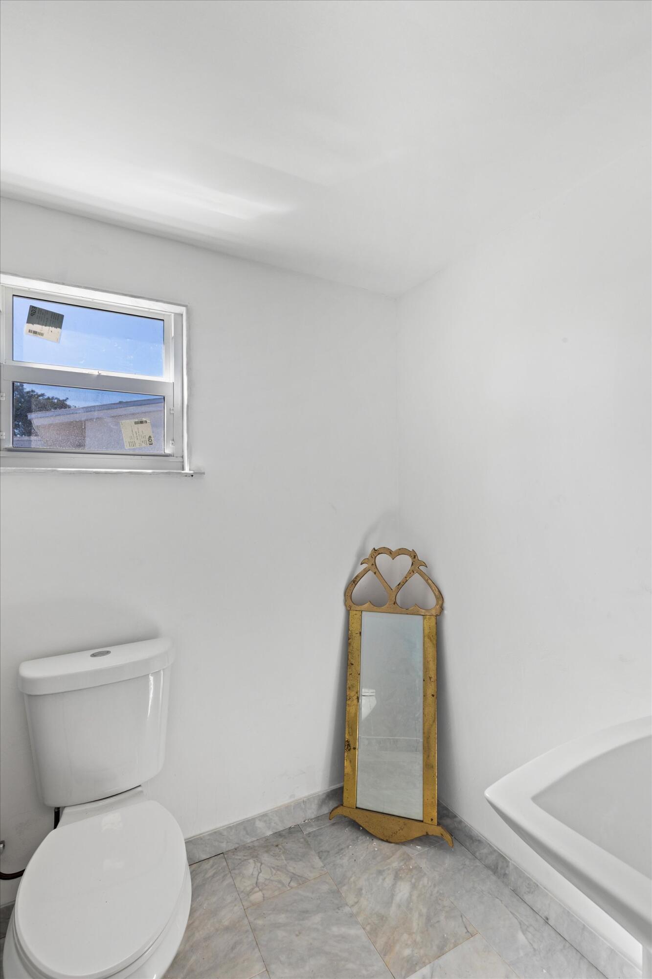 2924 Riviera Drive Key West, FL 33040 - Photo 22 of 43 a bathroom with a toilet