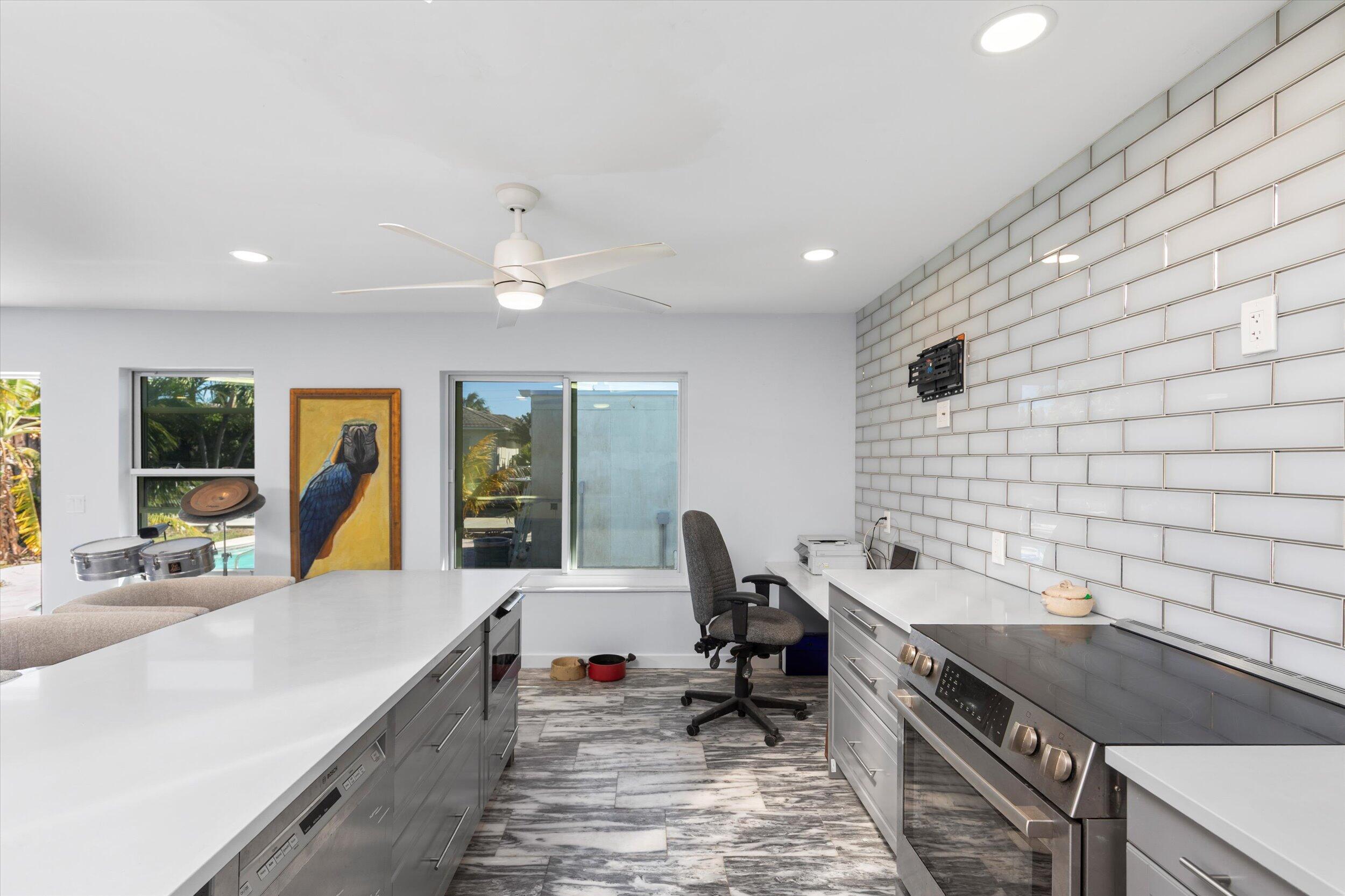 2924 Riviera Drive Key West, FL 33040 - Photo 30 of 43 a kitchen with stainless steel appliances granite countertop a sink stove and cabinets
