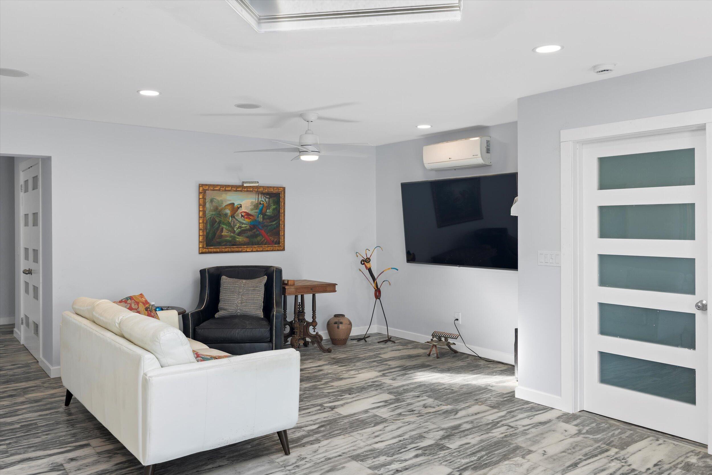 2924 Riviera Drive Key West, FL 33040 - Photo 32 of 43 a living room with furniture and a flat screen tv