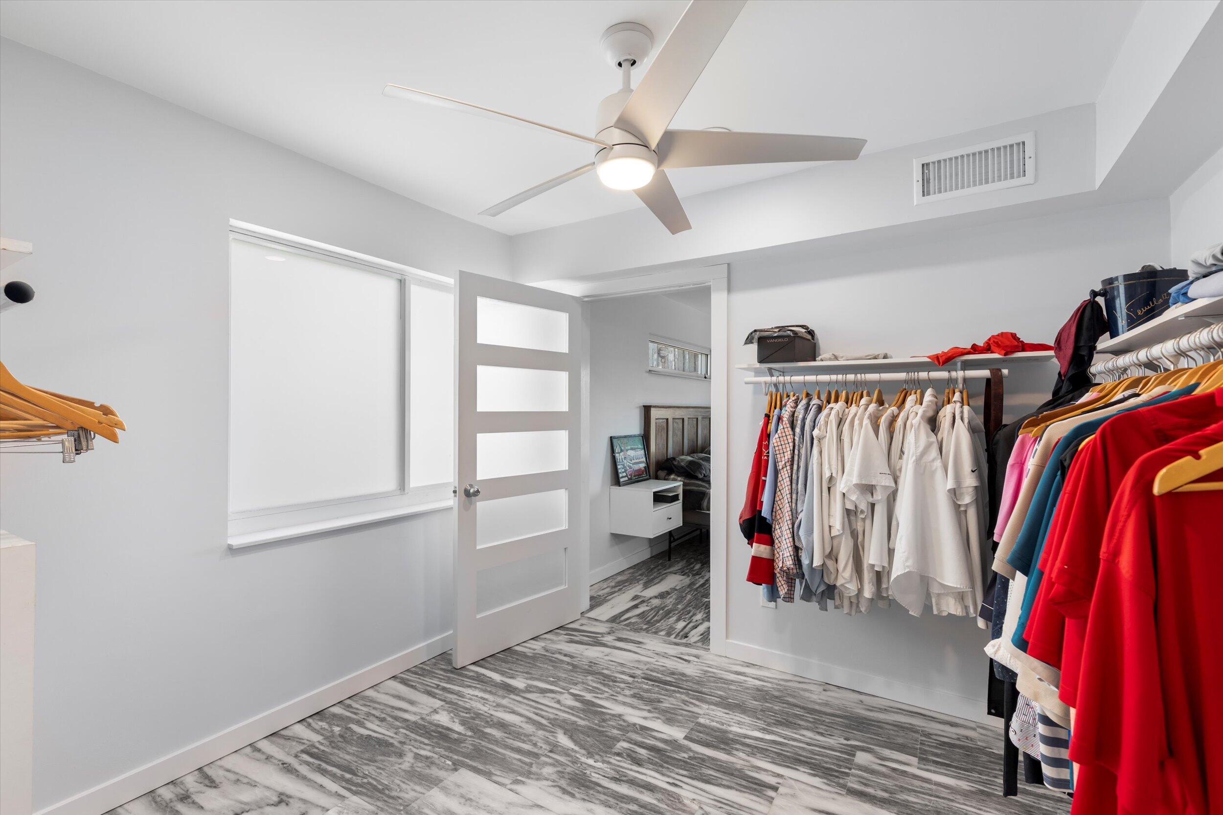 2924 Riviera Drive Key West, FL 33040 - Photo 34 of 43 a view of a room with clothes and shoes