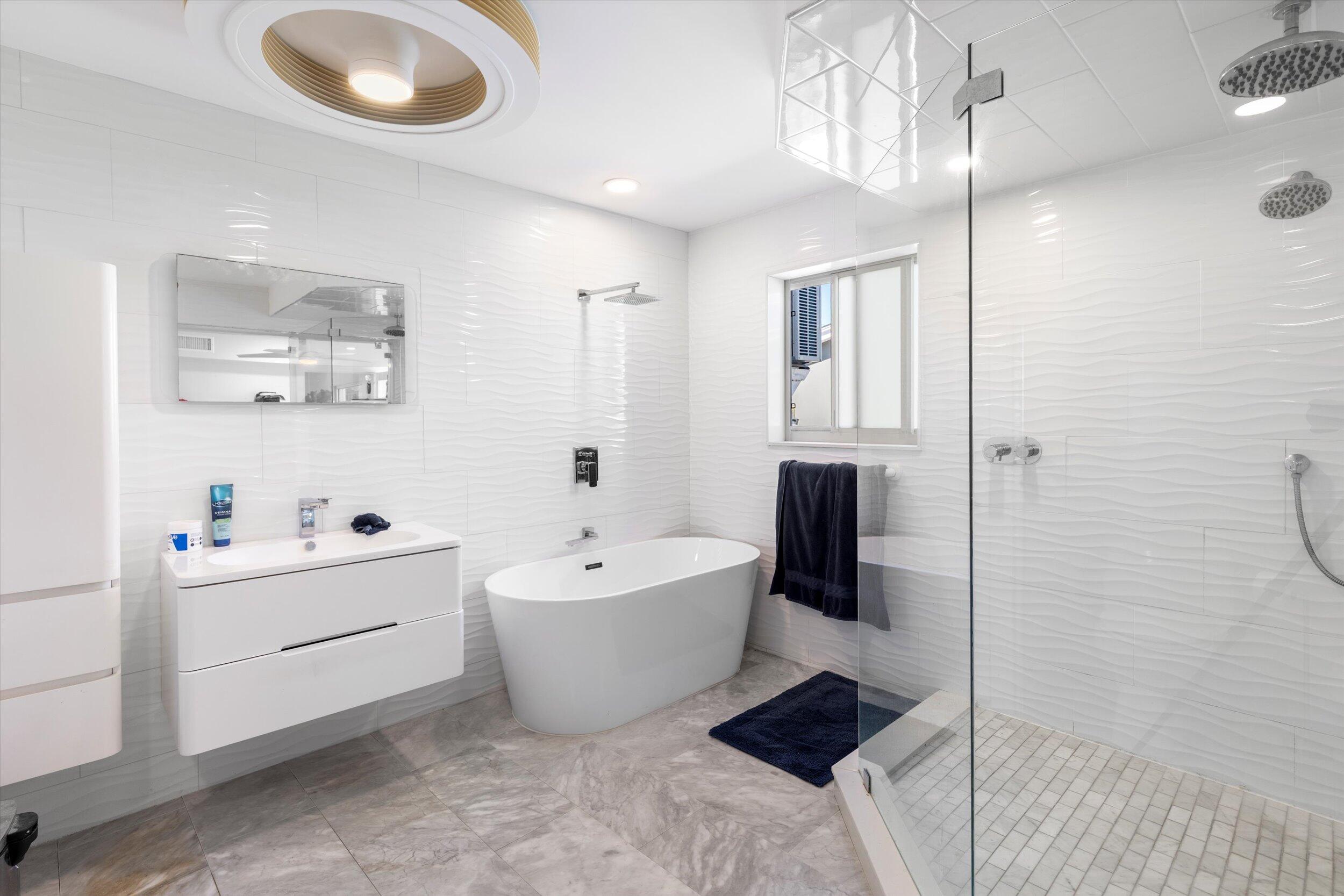 2924 Riviera Drive Key West, FL 33040 - Photo 36 of 43 a bathroom with a bathtub sink and toilet