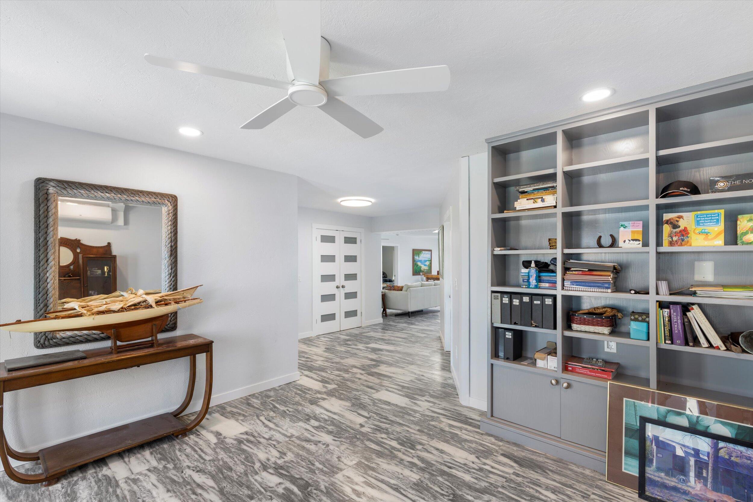 2924 Riviera Drive Key West, FL 33040 - Photo 5 of 43 a living room with furniture and a book shelf