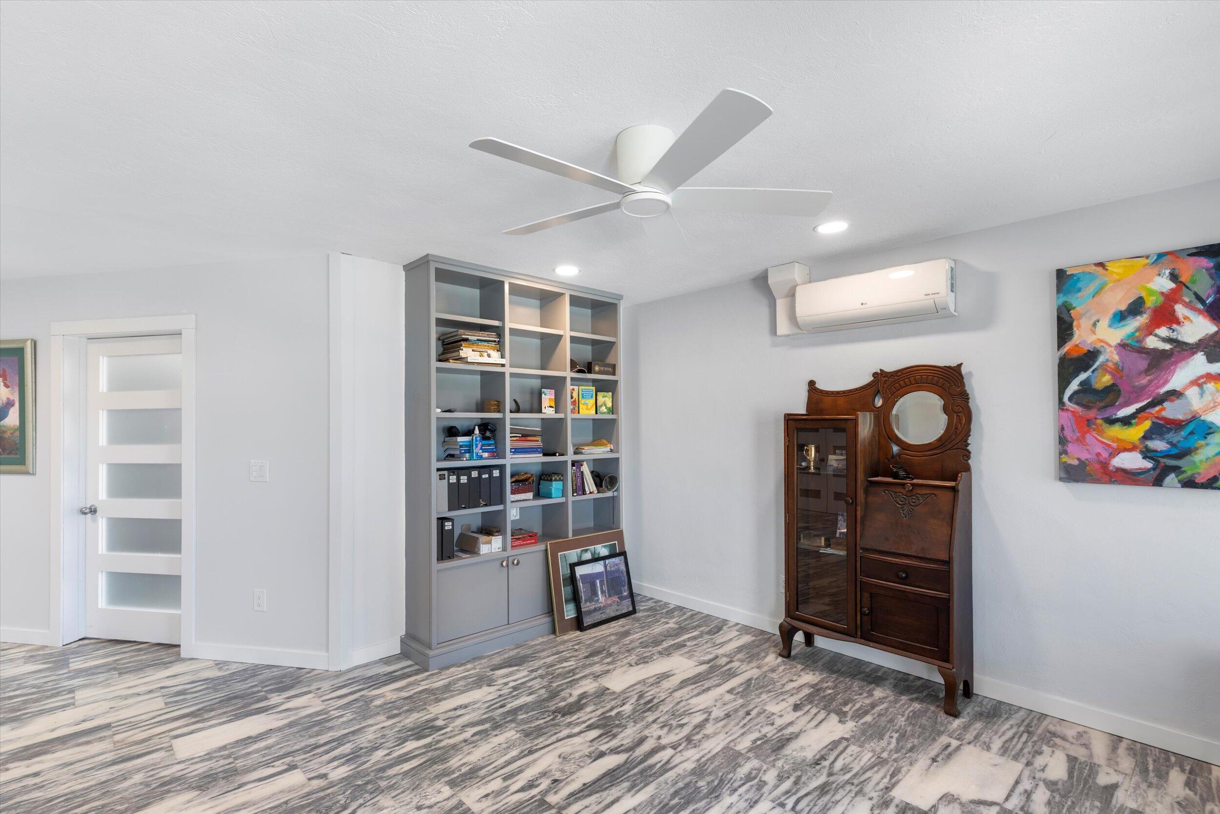 2924 Riviera Drive Key West, FL 33040 - Photo 6 of 43 a view of a livingroom with wooden floor and furniture
