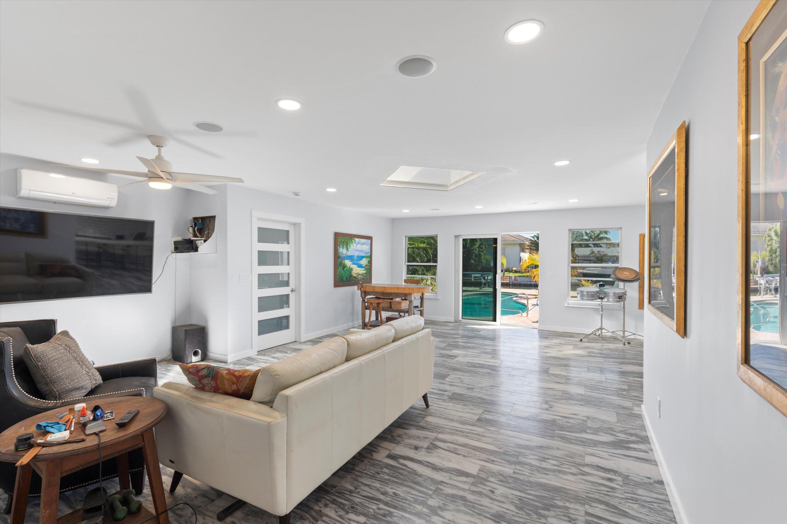 2924 Riviera Drive Key West, FL 33040 - Photo 8 of 43 a living room with furniture and a flat screen tv