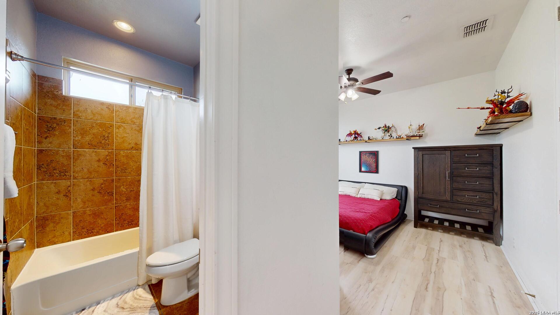 10111 Shallow Bank Converse, TX 78109 - Photo 37 of 65 a bedroom with a bed and a couch