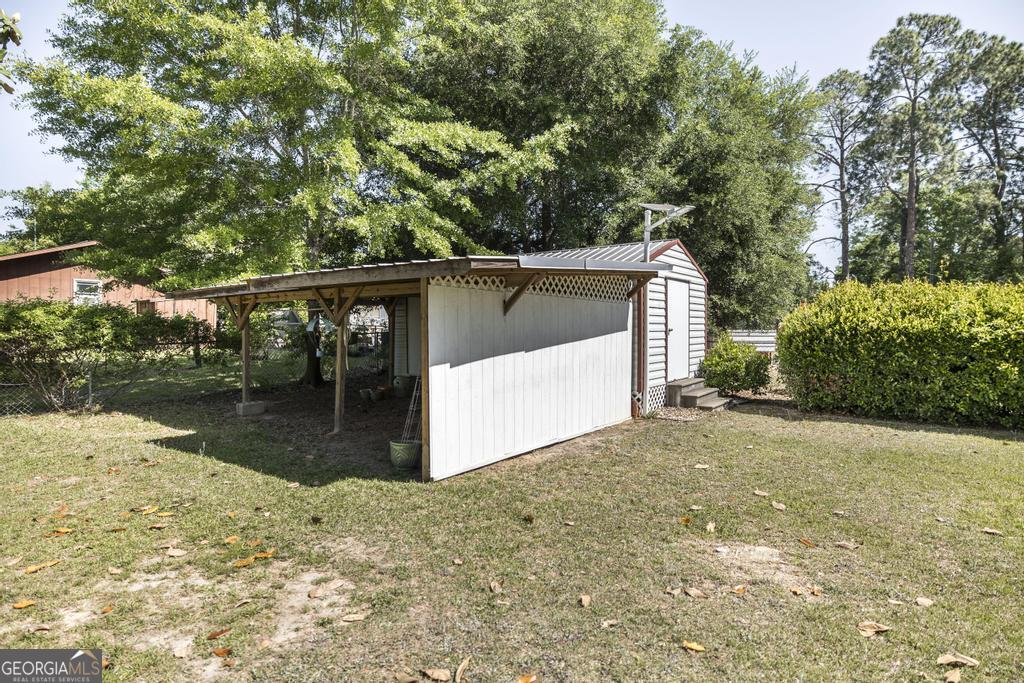 129 South 7th Street Cochran, GA 31014 - Photo 36 of 54 A large two bay wired workshop provides excellent workspace.