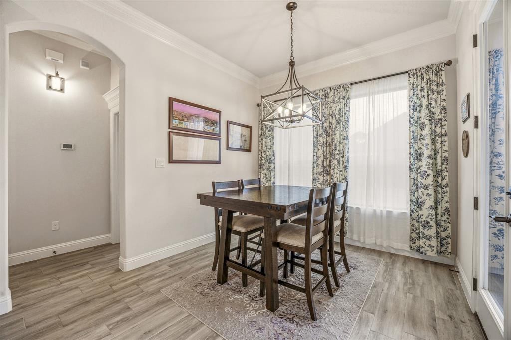 3024 Reed Court Granbury, TX 76048 - Photo 14 of 40 a view of a dining room with furniture window and wooden floor