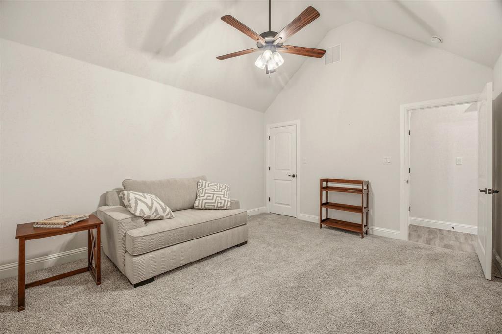 3024 Reed Court Granbury, TX 76048 - Photo 26 of 40 a living room with furniture and a ceiling fan