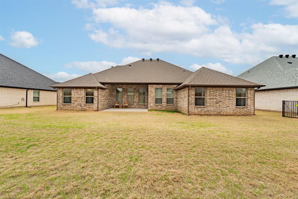3024 Reed Court Granbury, TX 76048 - Photo 30 of 40 a house with swimming pool in front of it
