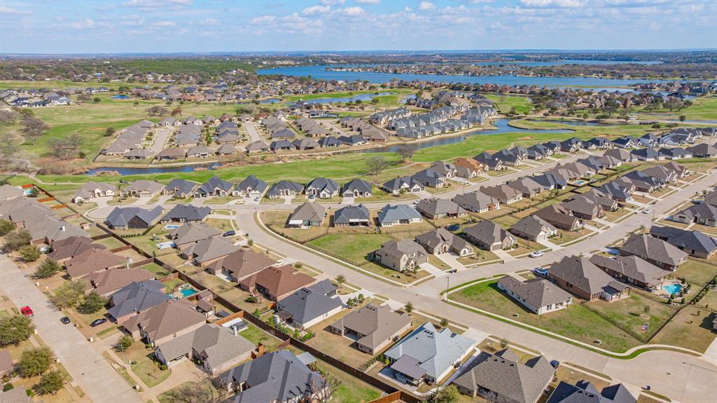 3024 Reed Court Granbury, TX 76048 - Photo 36 of 40 an aerial view of a city with lots of residential buildings and ocean view