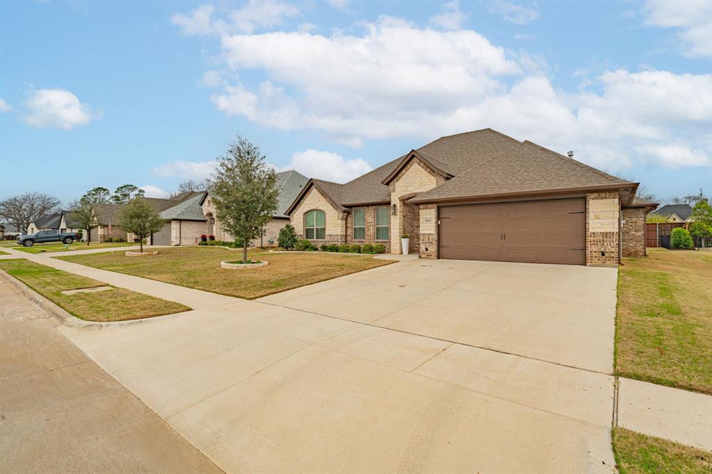 3024 Reed Court Granbury, TX 76048 - Photo 4 of 40 a house view with a outdoor space