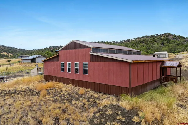 a backyard of a house with a yard and lake view