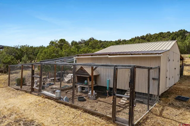 a view of a chairs and table in the patio