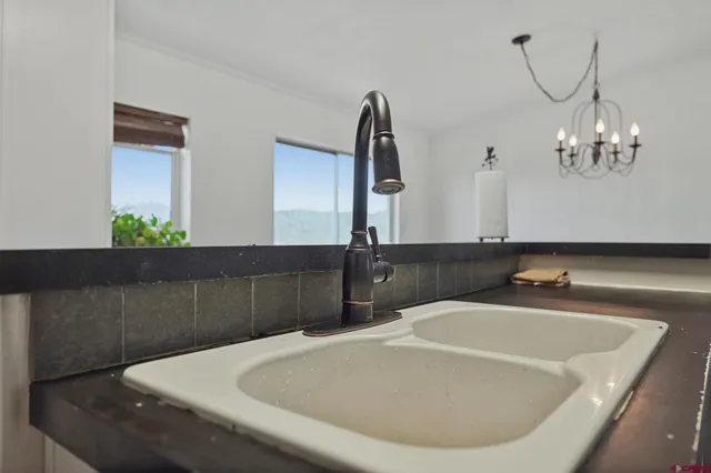 a bathroom with a bathtub and a mirror