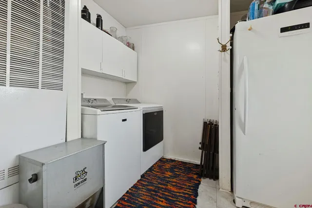 a view of a storage & utility room with washer and dryer