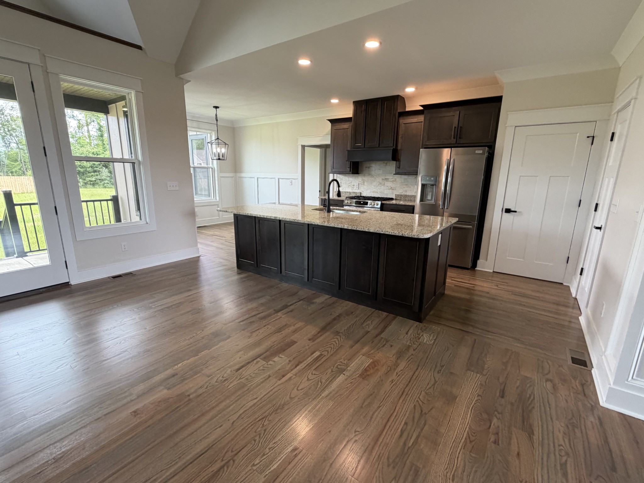 1258 Tom Grissom Road Morrison, TN 37357 - Photo 3 of 8 a view of kitchen with stainless steel appliances wooden floor and wooden cabinets