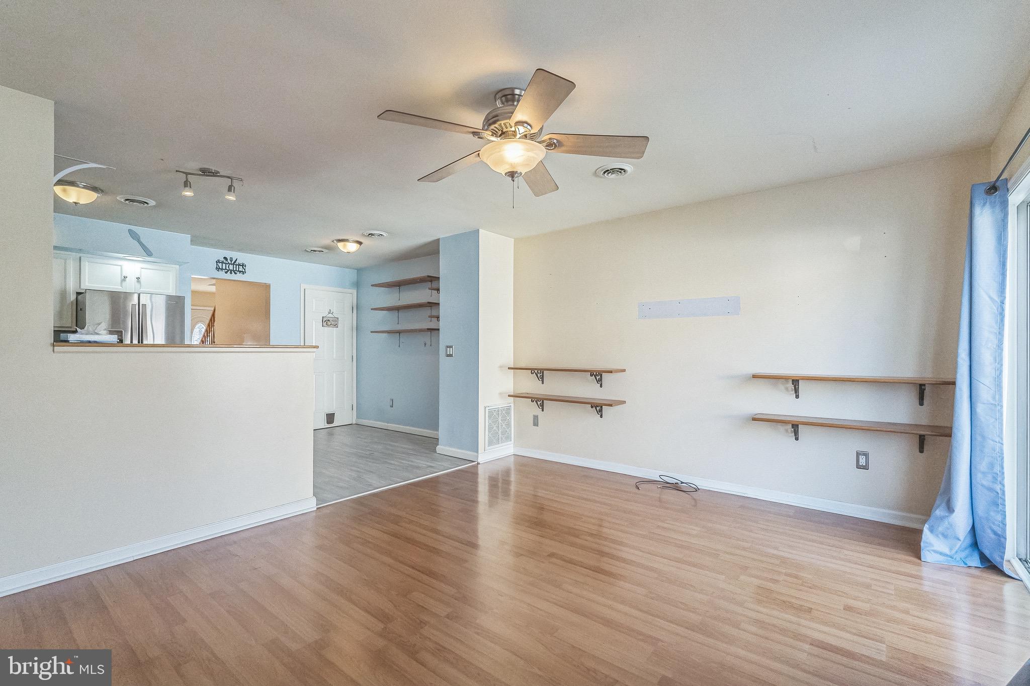 3566 Edgemont Street Philadelphia, PA 19134 - Photo 13 of 25 a view of a kitchen with wooden floor and a ceiling fan