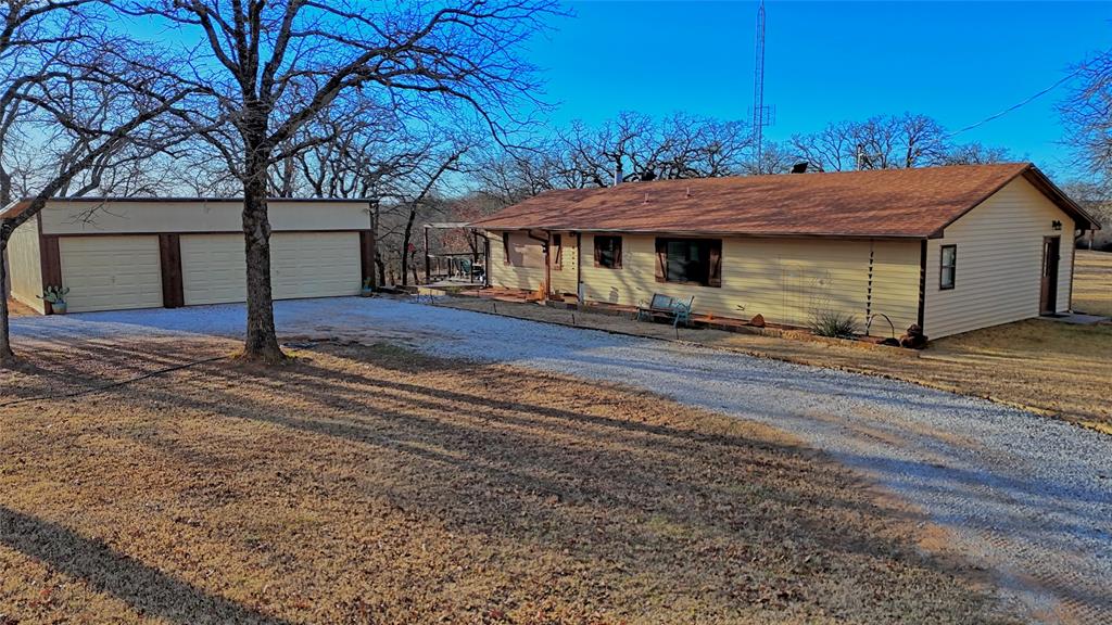 858 Ford Road Bowie, TX 76230 - Photo 1 of 40 a view of a house with a yard