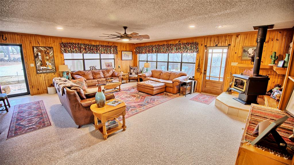 858 Ford Road Bowie, TX 76230 - Photo 11 of 40 a living room with furniture a couch and large windows