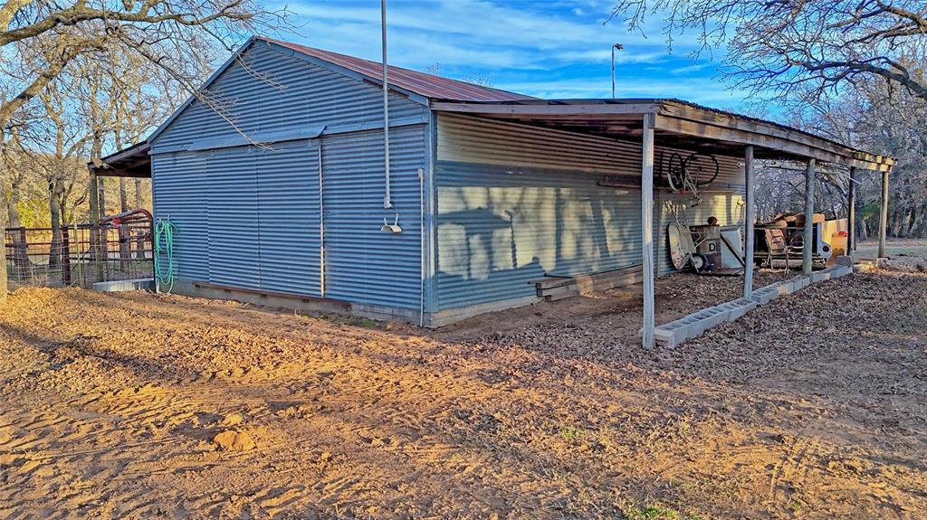 858 Ford Road Bowie, TX 76230 - Photo 17 of 40 a view of a house with a backyard
