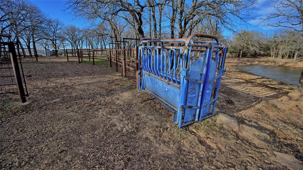 858 Ford Road Bowie, TX 76230 - Photo 29 of 40 a view of a yard with wooden fence