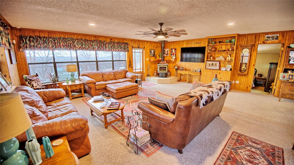 858 Ford Road Bowie, TX 76230 - Photo 4 of 40 a outdoor living space with furniture and a large window