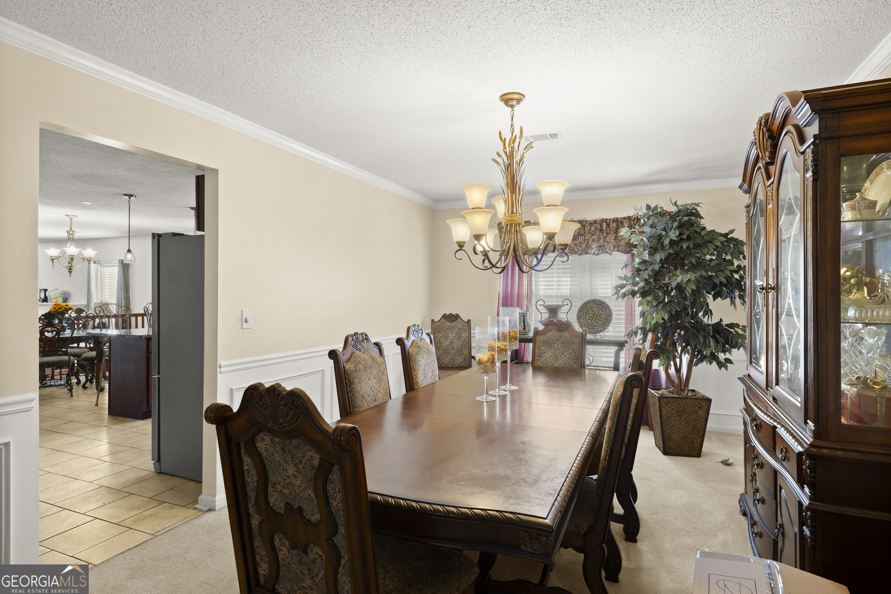 11961 Markham Way Hampton, GA 30228 - Photo 11 of 49 a view of a dining room with furniture and a chandelier