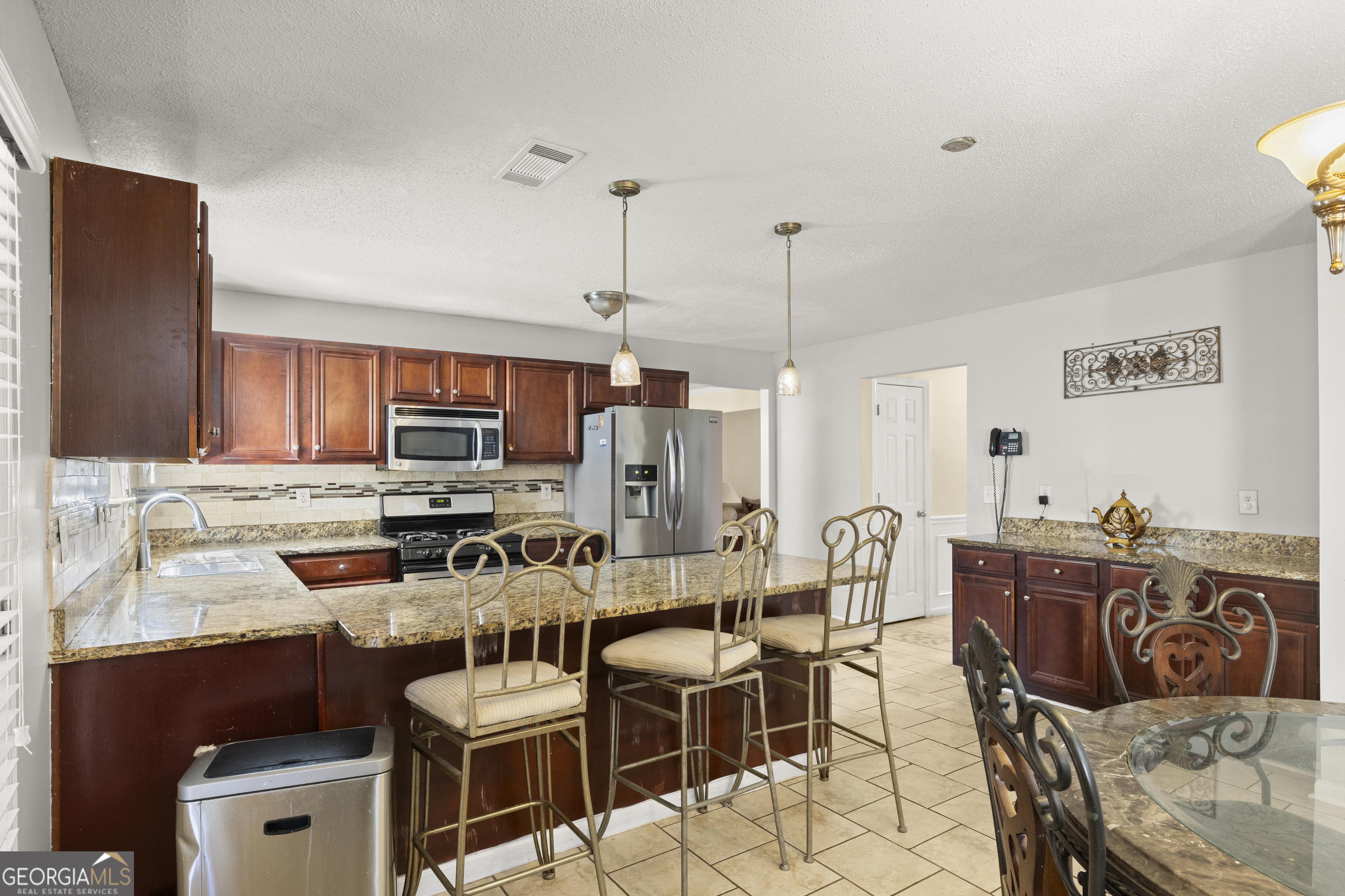 11961 Markham Way Hampton, GA 30228 - Photo 15 of 49 a view of a dining room with furniture