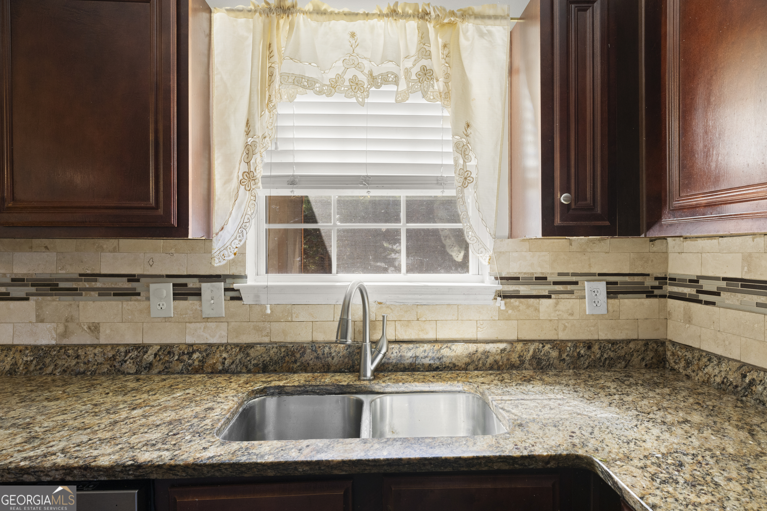 11961 Markham Way Hampton, GA 30228 - Photo 17 of 49 a kitchen with granite countertop a sink and a stove