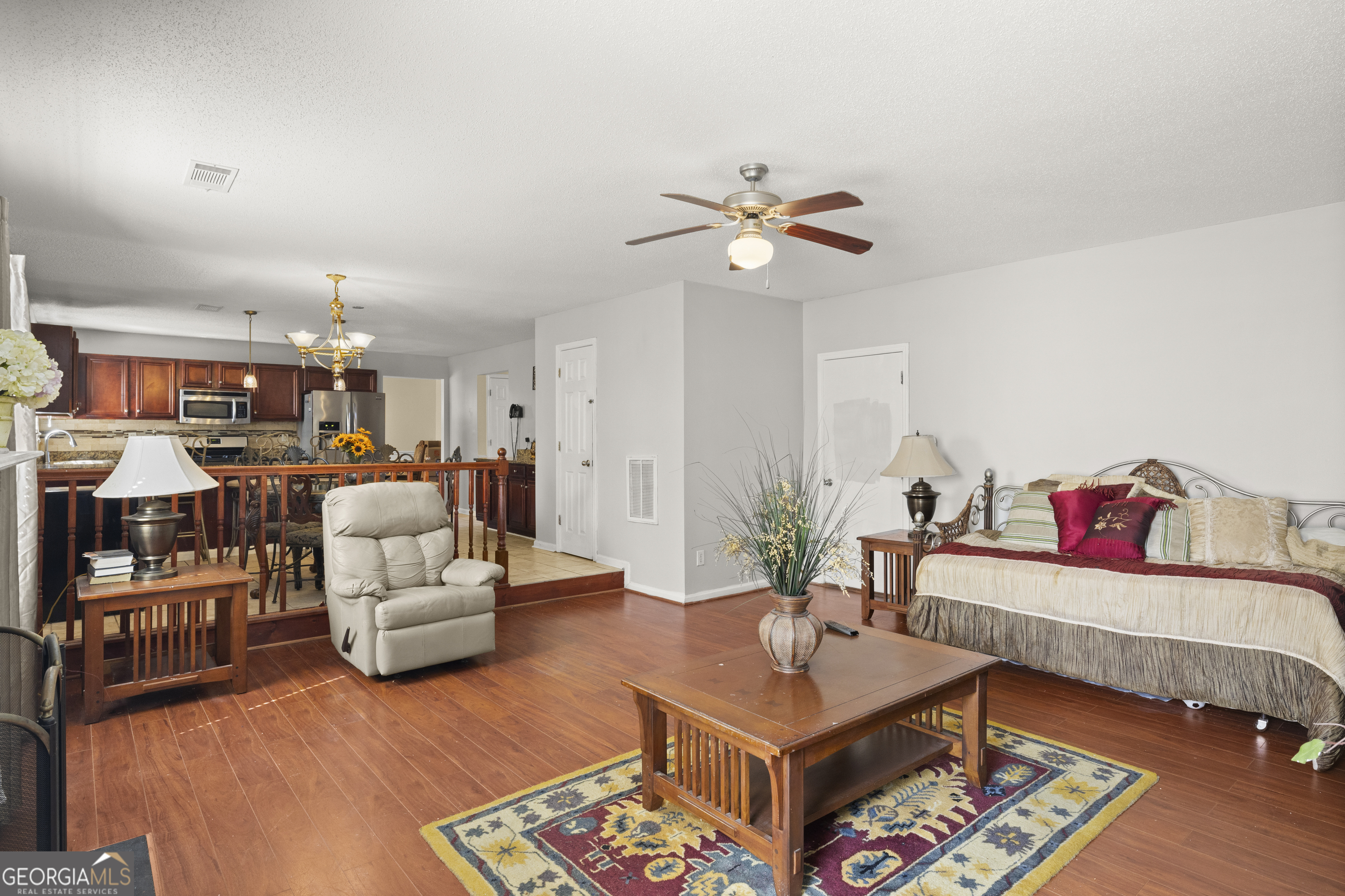 11961 Markham Way Hampton, GA 30228 - Photo 20 of 49 a living room with furniture and wooden floor