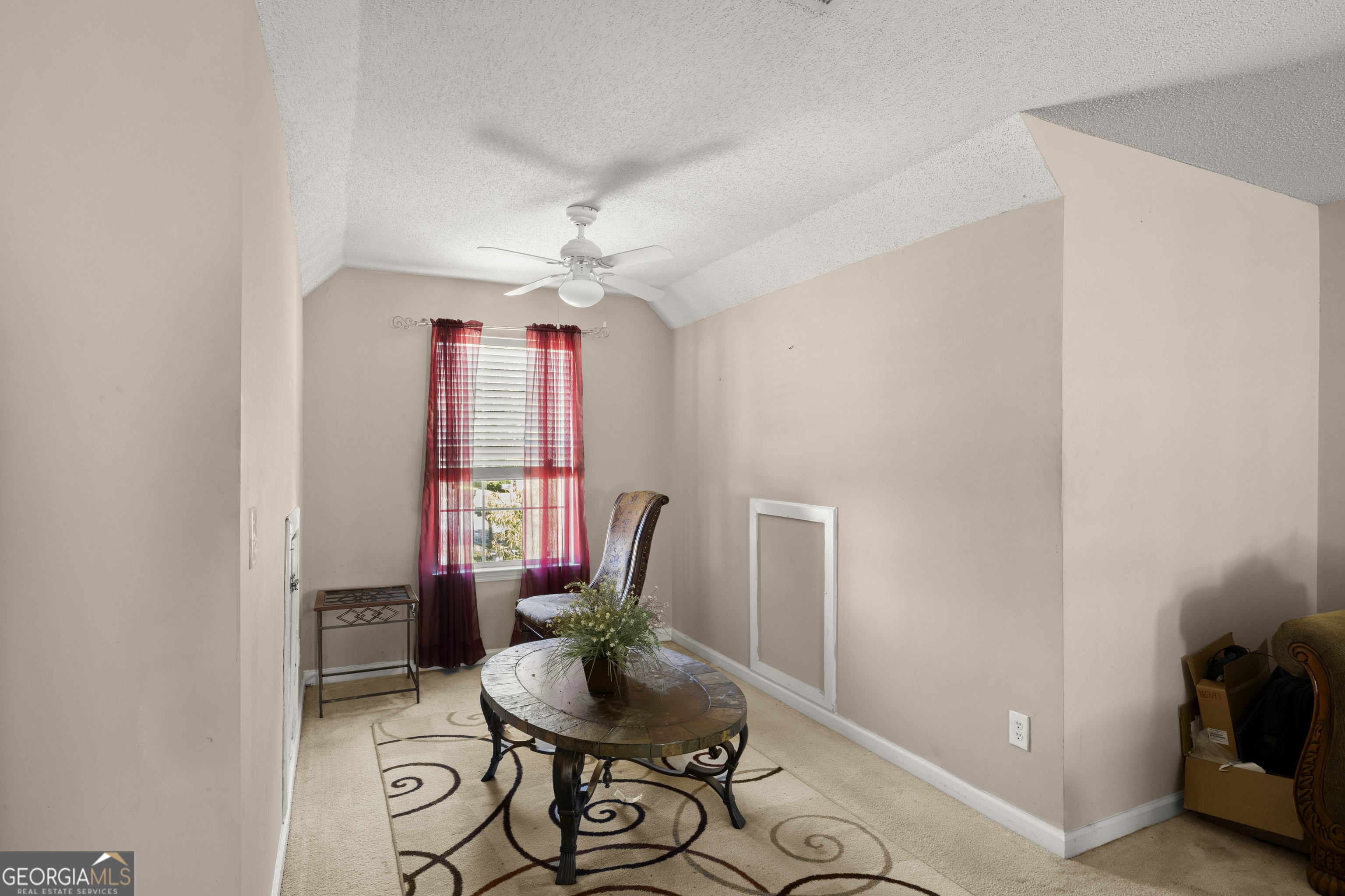 11961 Markham Way Hampton, GA 30228 - Photo 25 of 49 a living room with furniture and a chandelier