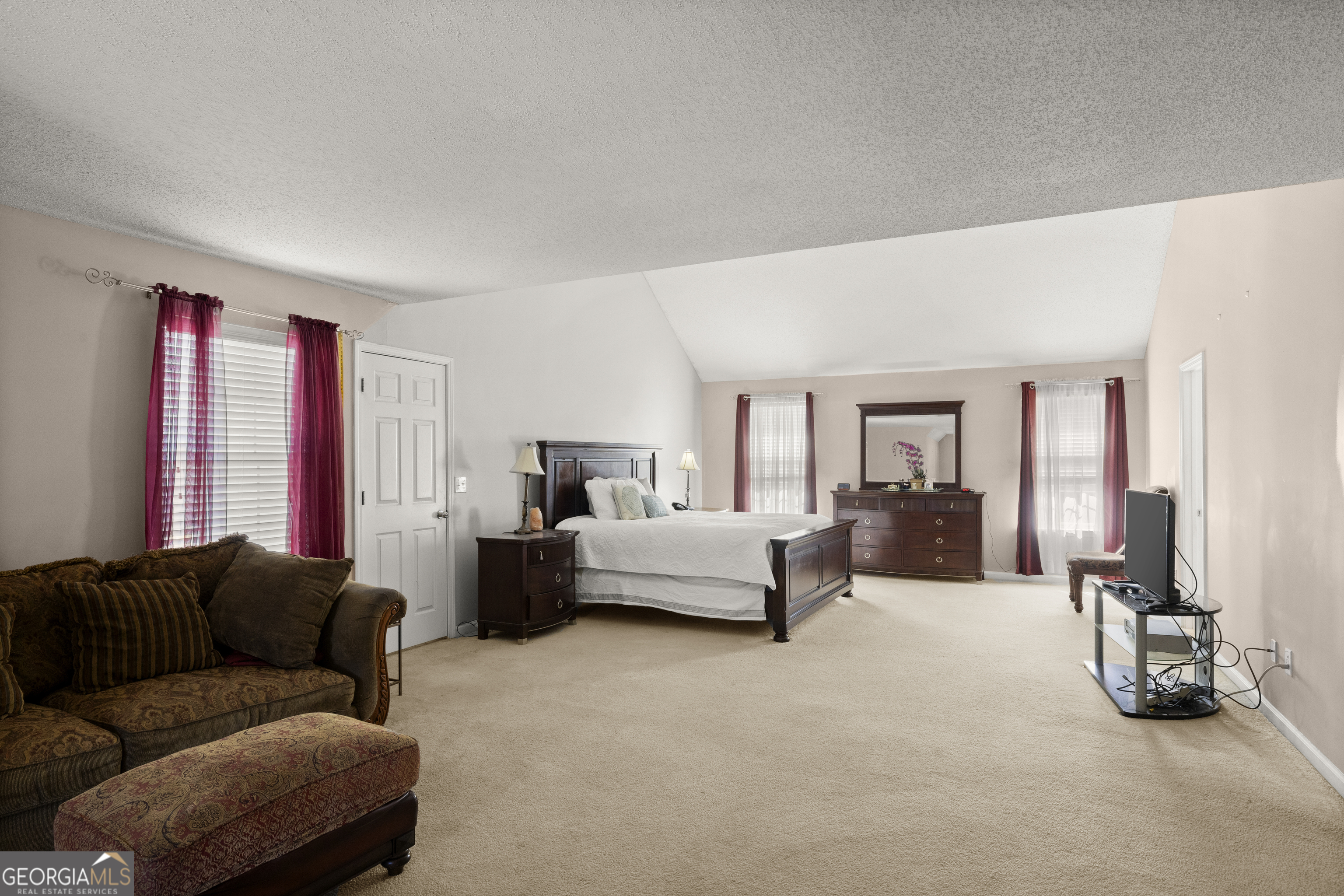 11961 Markham Way Hampton, GA 30228 - Photo 26 of 49 a living room with furniture and a large window