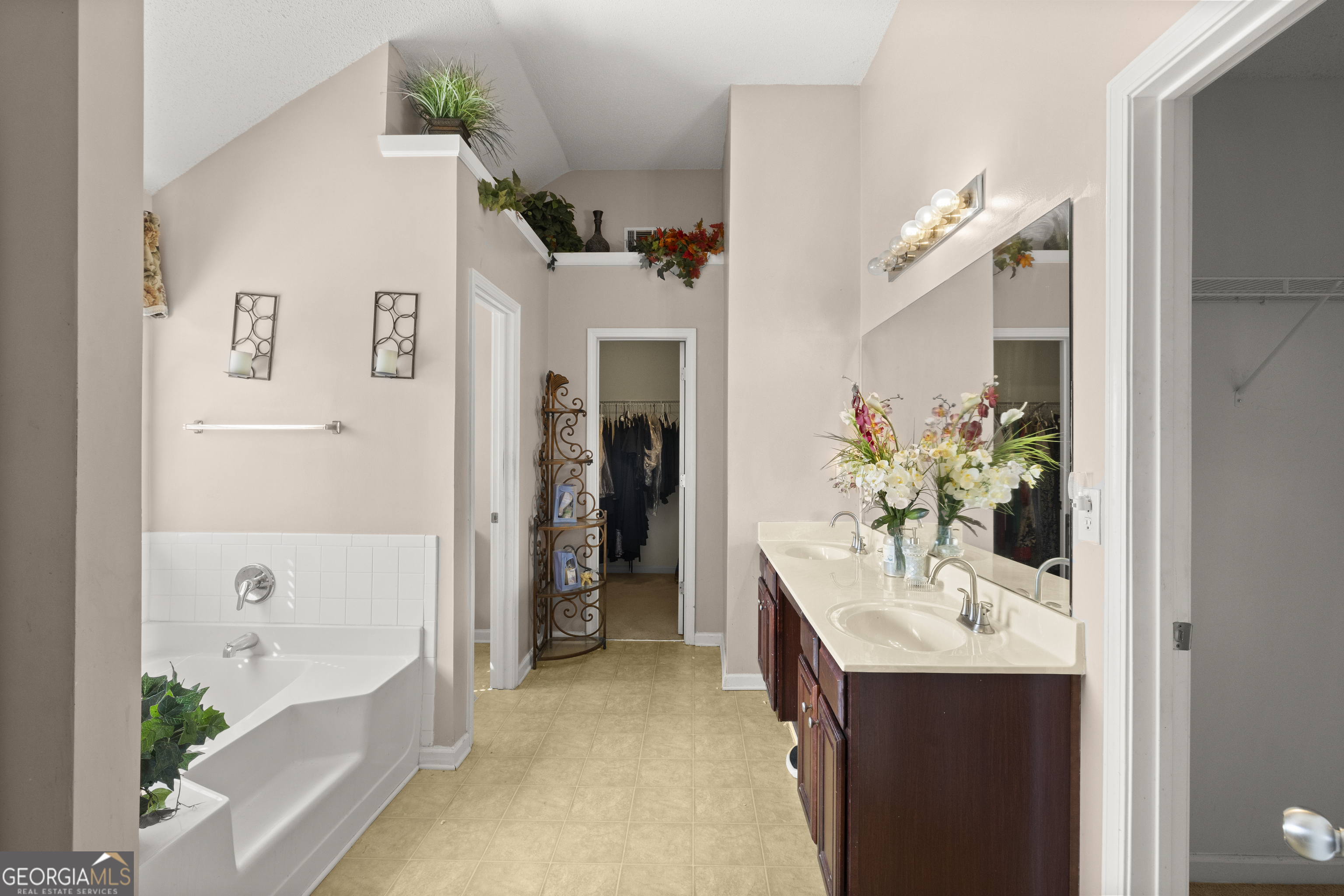 11961 Markham Way Hampton, GA 30228 - Photo 27 of 49 a bathroom with a sink tub shower and a mirror