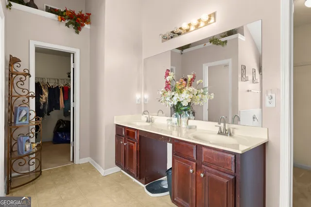 a bathroom with a sink vanity and a mirror