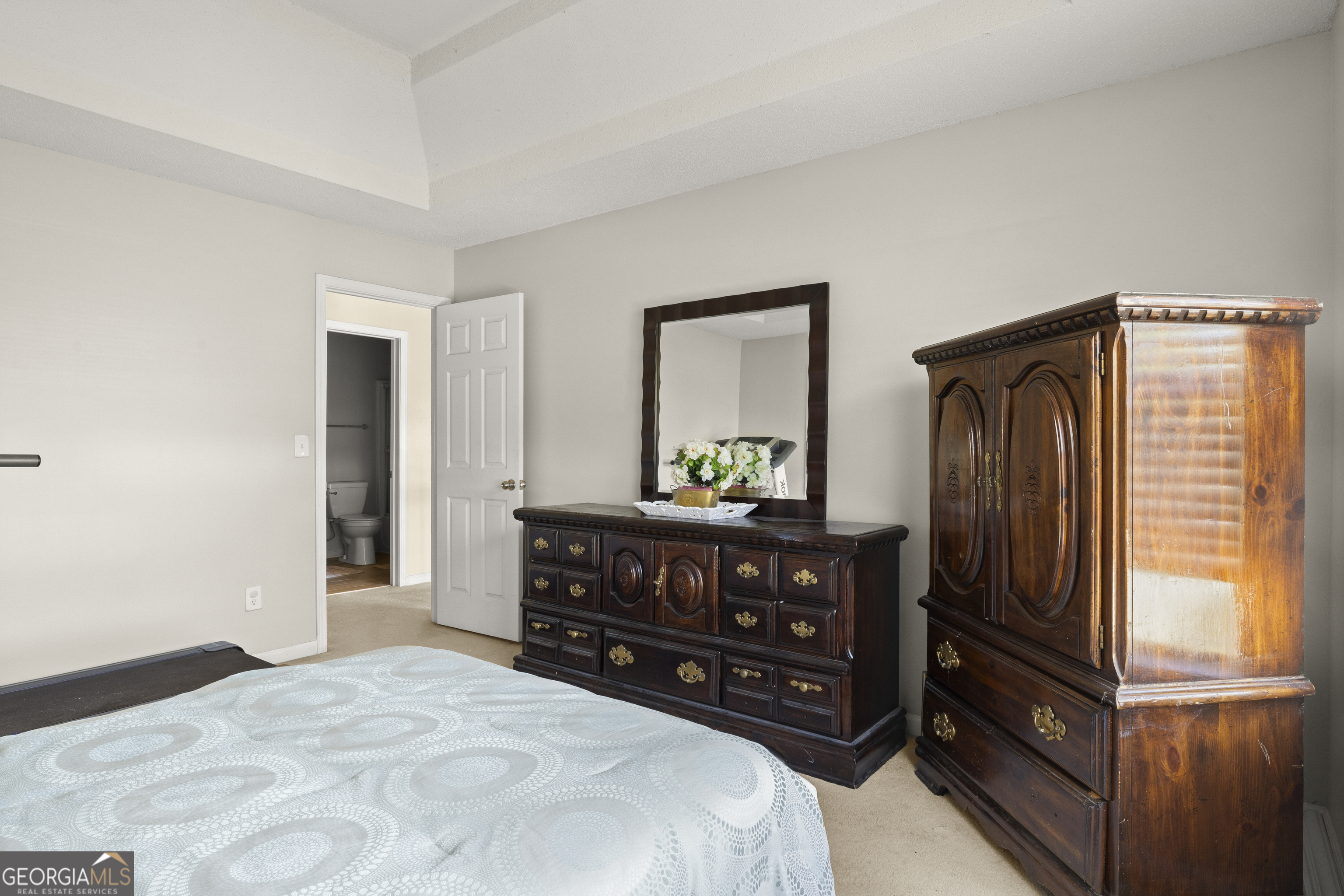 11961 Markham Way Hampton, GA 30228 - Photo 34 of 49 a bedroom with a bed and a dresser