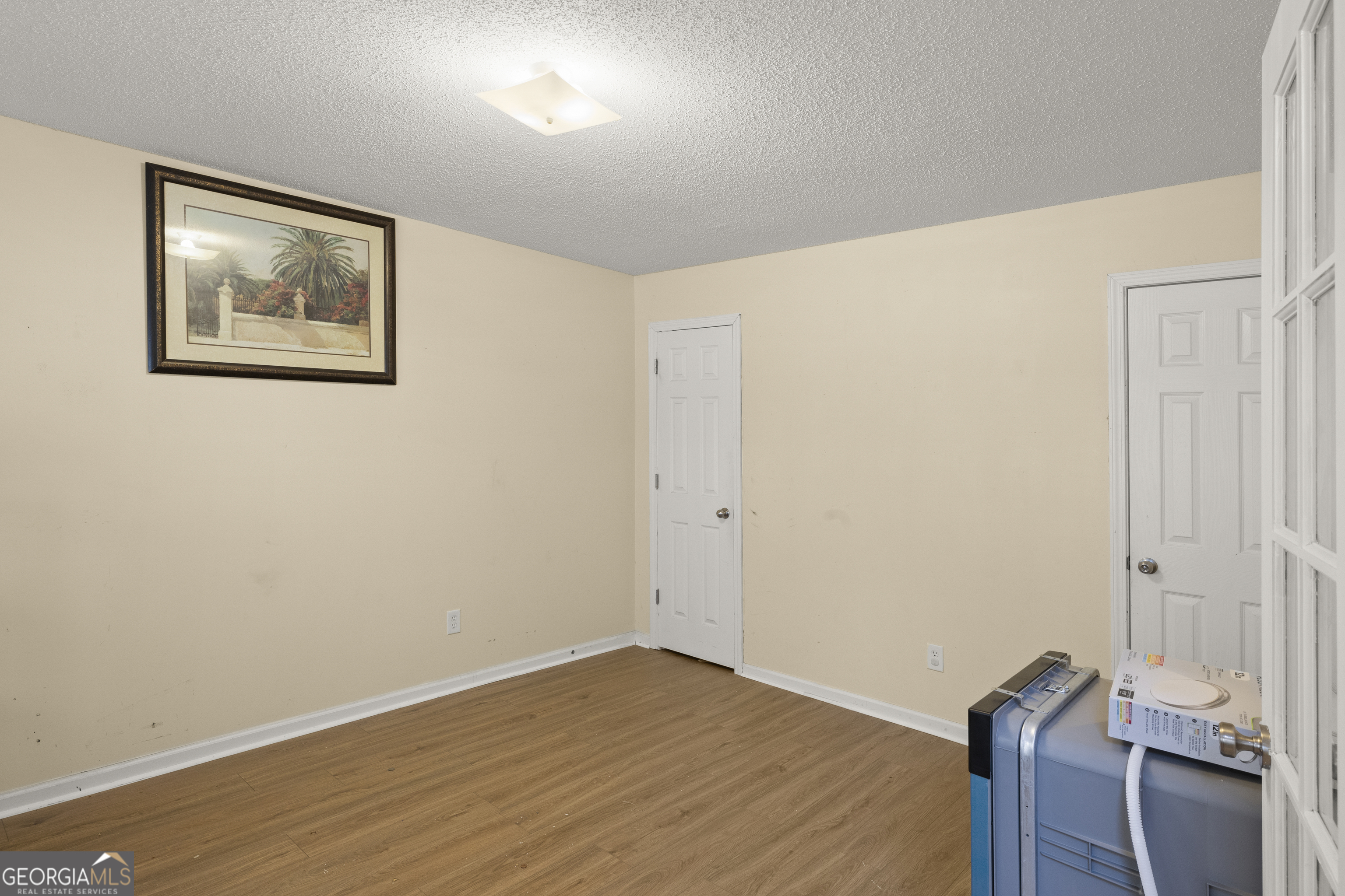 11961 Markham Way Hampton, GA 30228 - Photo 4 of 49 a view of room with wooden floor and window